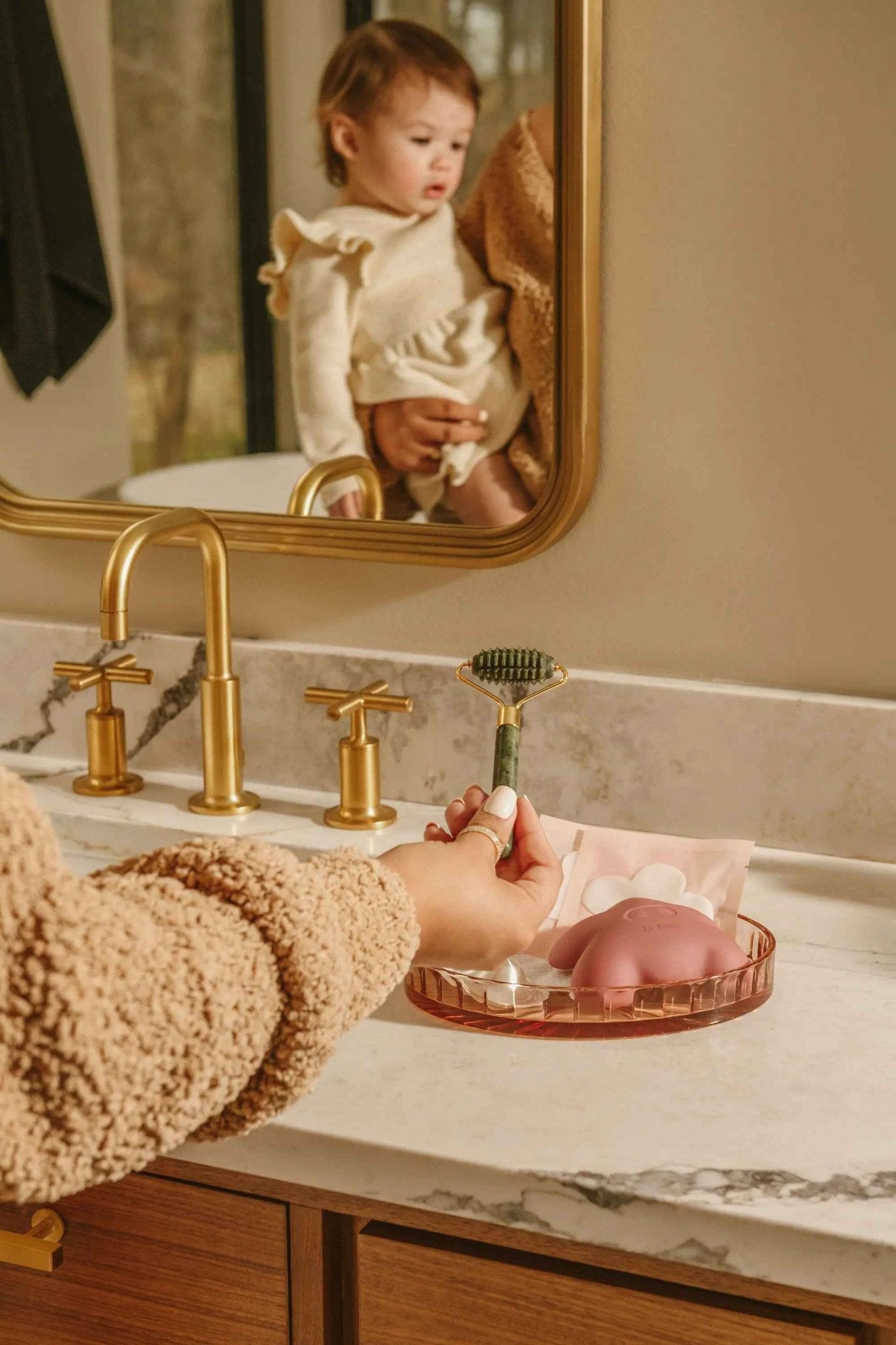 Le Lolo lactation jade roller for breastfeeding support, featuring smooth jade stones and ergonomic handle for gentle massage.