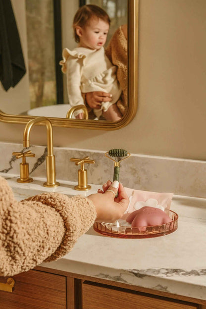 Le Lolo lactation jade roller for breastfeeding support, featuring smooth jade stones and ergonomic handle for gentle massage.