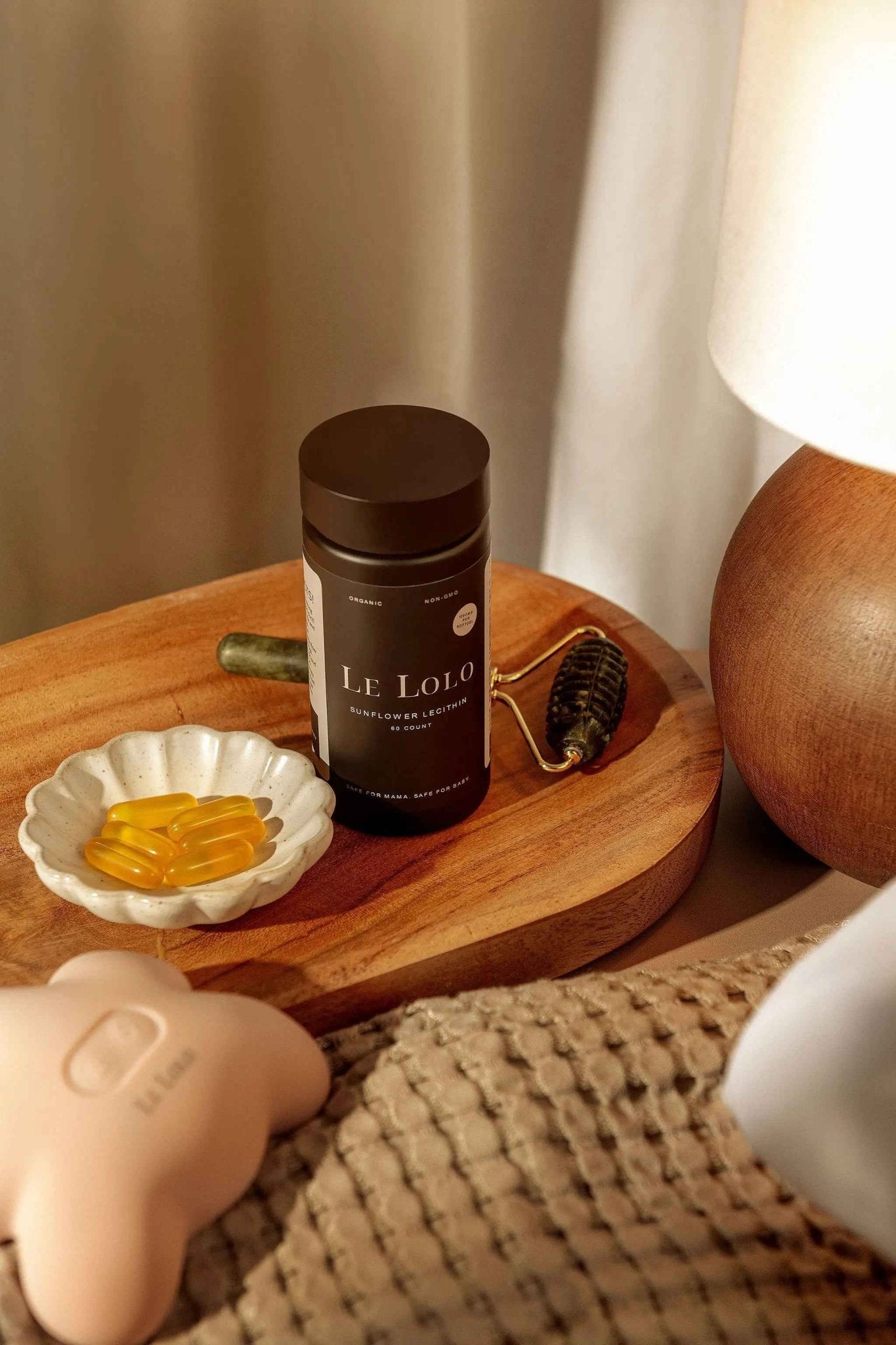 Le Lolo Lactation Jade Roller with smooth jade stones, designed for soothing massage and promoting milk flow.