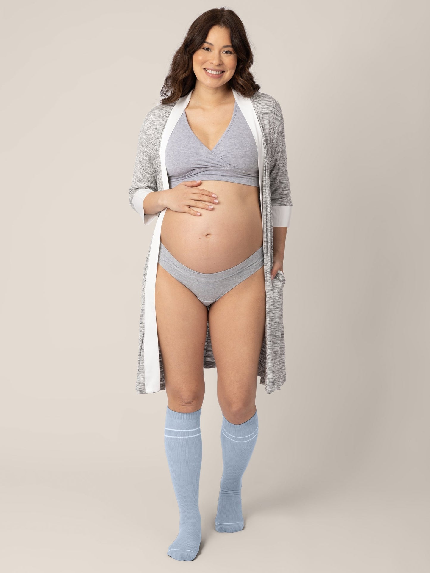 Pair of maternity compression socks in stone blue and black by Kindred Bravely, designed for comfort and support during pregnancy.