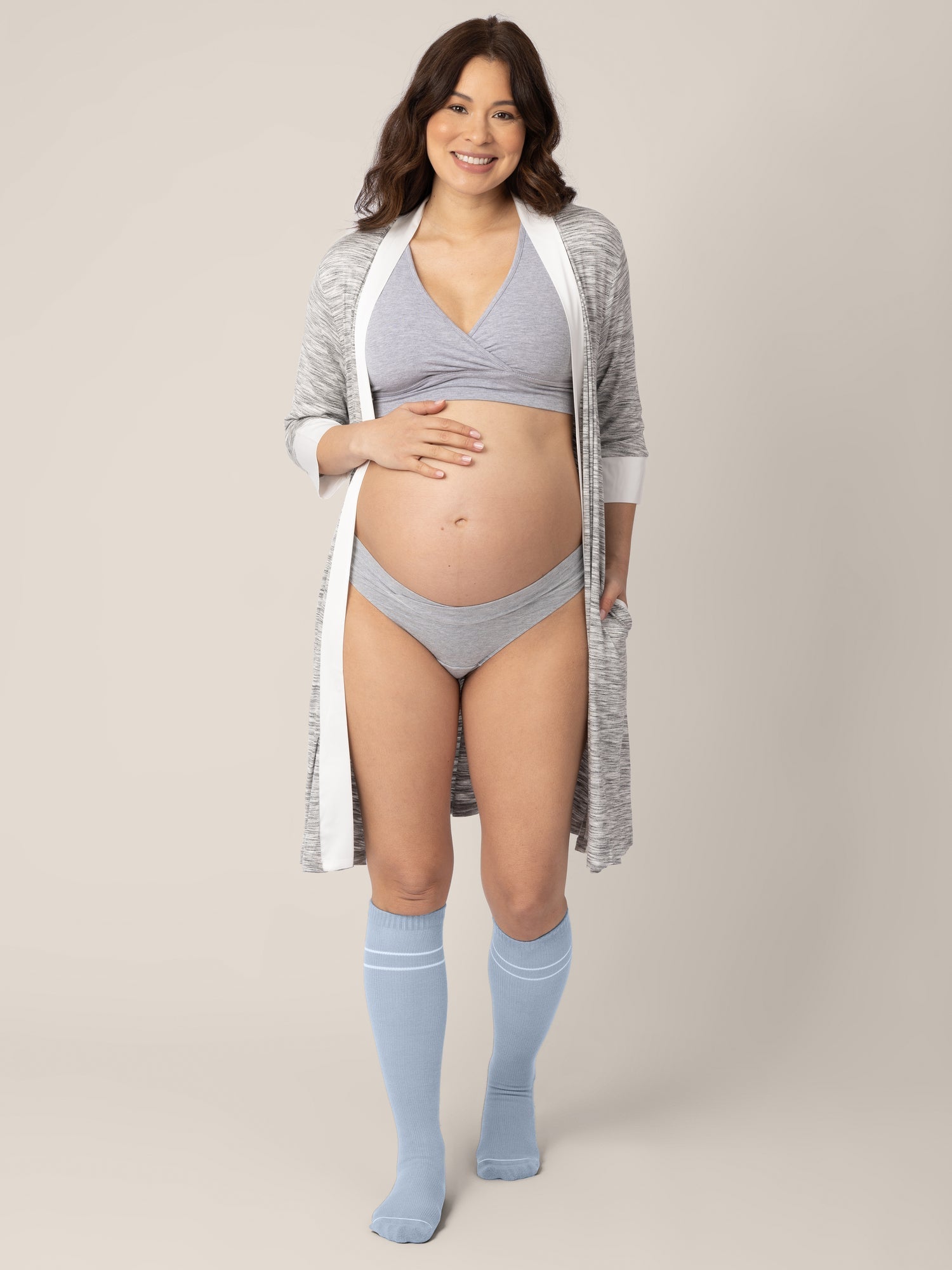 Pair of maternity compression socks in stone blue and black by Kindred Bravely, designed for comfort and support during pregnancy.