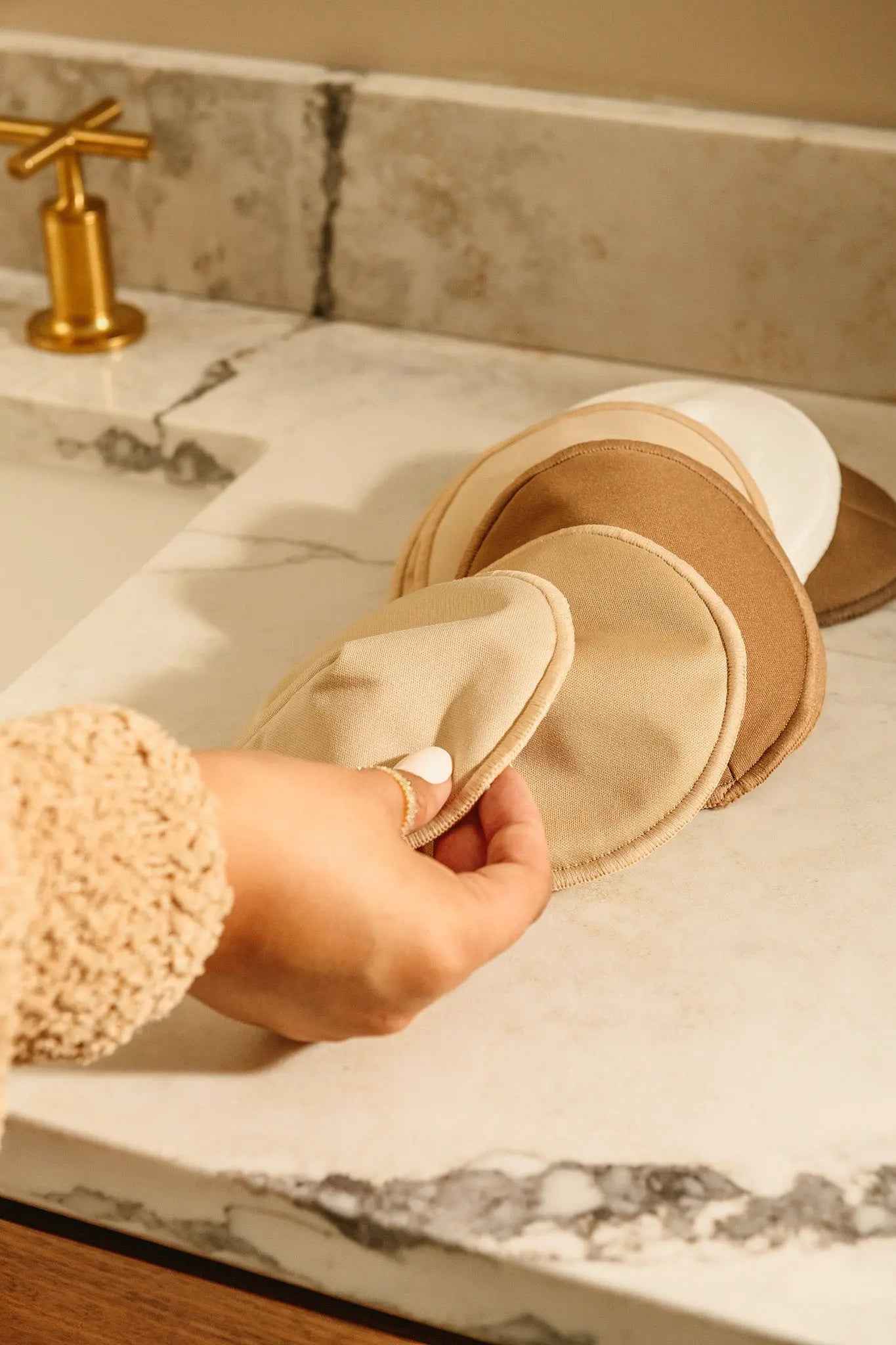 Set of reusable nursing pads by Le Lolo, soft and absorbent for comfortable breastfeeding support.