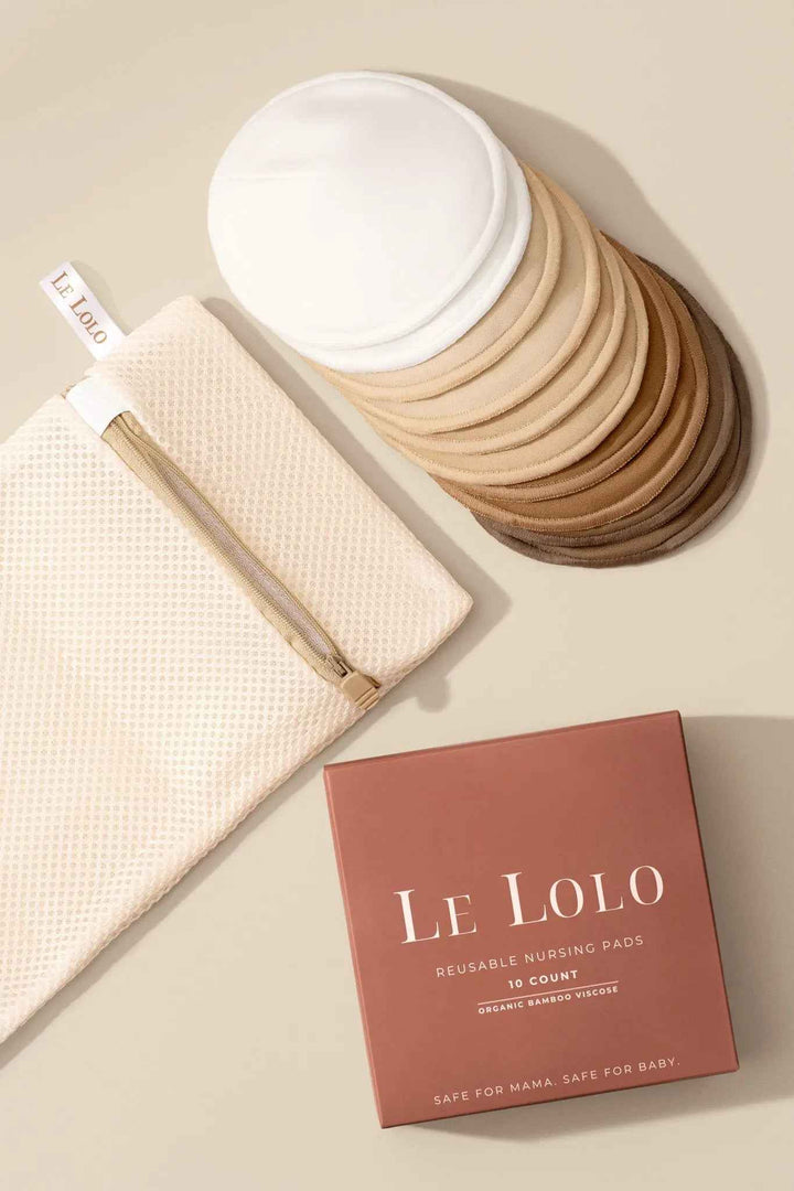 Le Lolo reusable nursing pads shown in a close-up, soft fabric with multiple layers for comfort and leak protection.