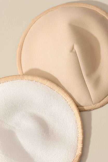 Set of reusable nursing pads by Le Lolo, soft and absorbent fabric for comfortable breastfeeding support.