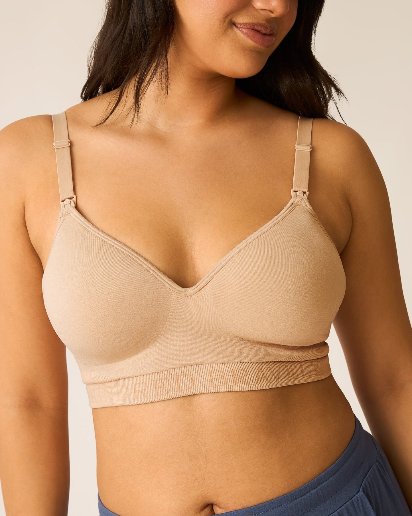 Beige Signature Sublime® Contour Hands-Free Pumping and Nursing Bra by Kindred Bravely, showing smooth fabric and supportive design.