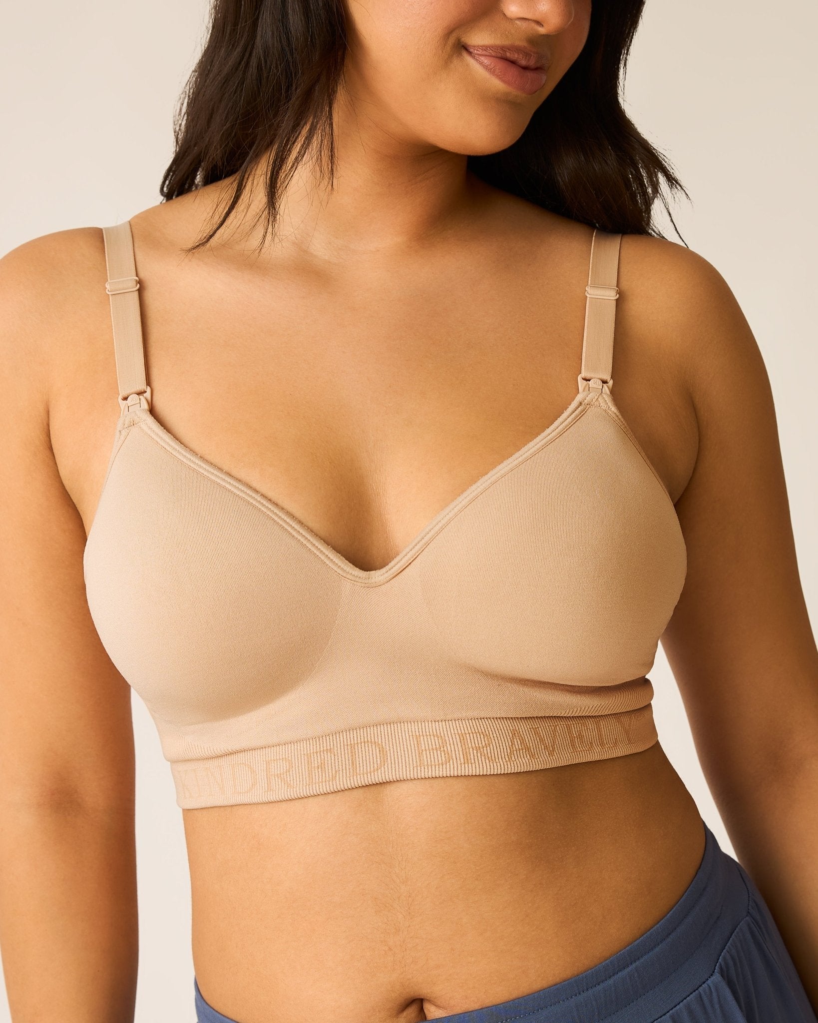 Beige Signature Sublime® Contour Hands-Free Pumping and Nursing Bra by Kindred Bravely, showing smooth fabric and supportive design.