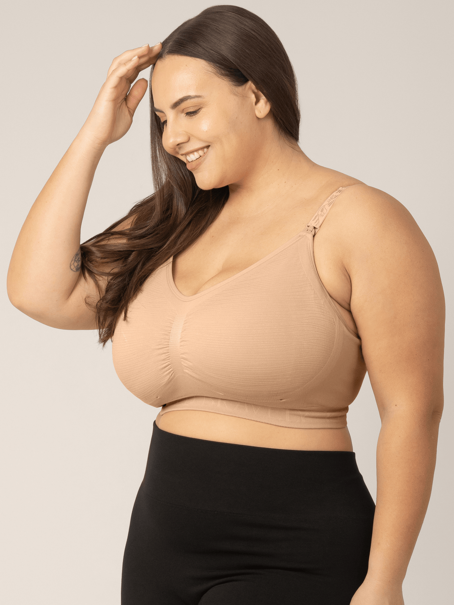 Beige Sublime® hands-free pumping and nursing bra by Kindred Bravely, showing comfortable fit and easy access design.