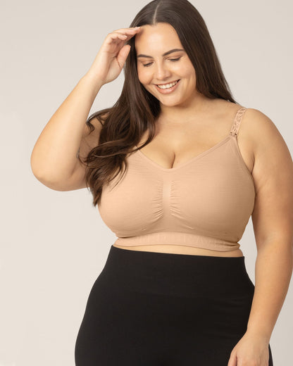 Beige Sublime® hands-free pumping and nursing bra by Kindred Bravely, shown laid flat with adjustable straps and clasps.
