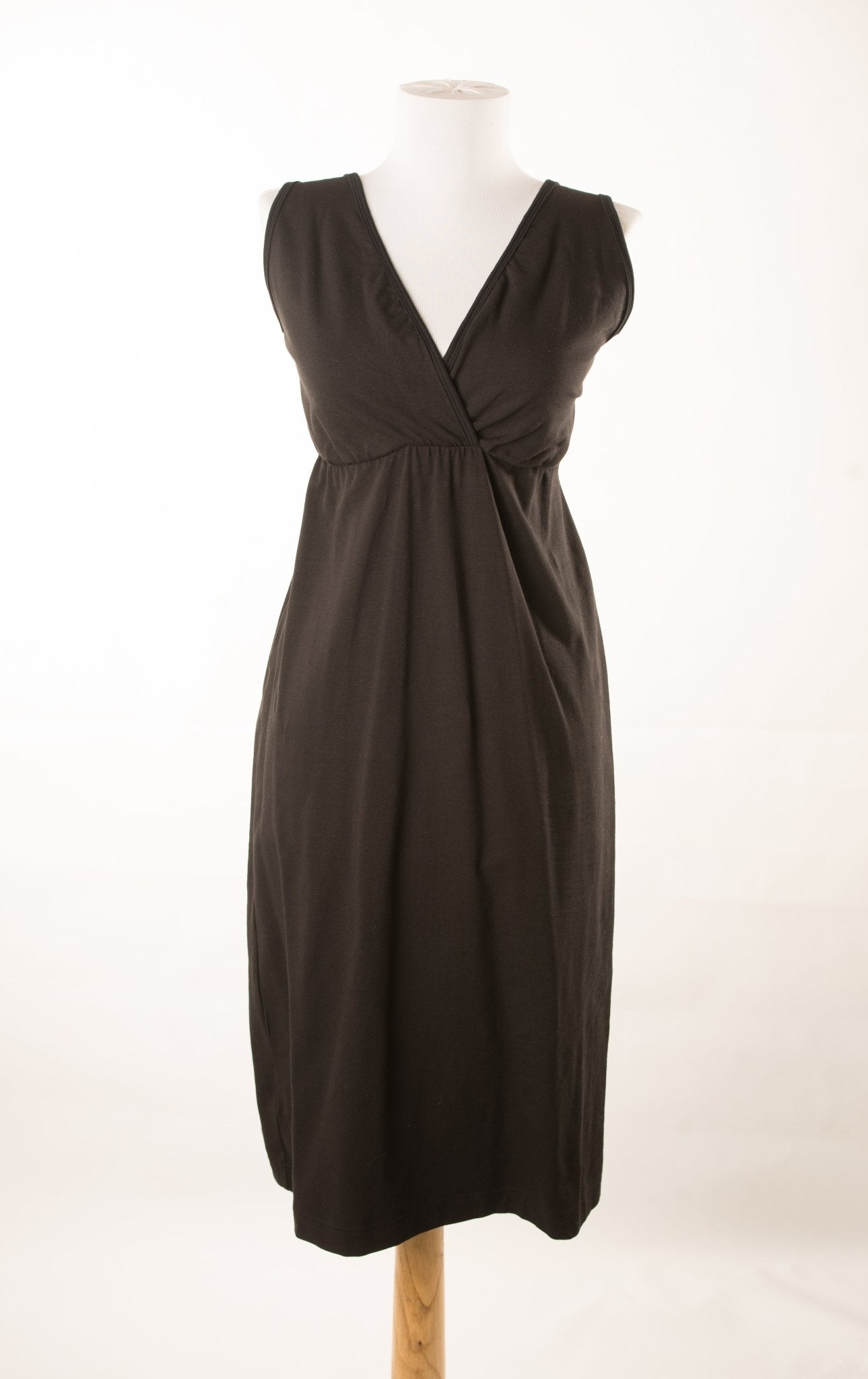 A woman wearing the Original Bra-less Aimee Gown by Aimee Nursing Gowns, showcasing the comfortable, flowy maternity and nursing dress.