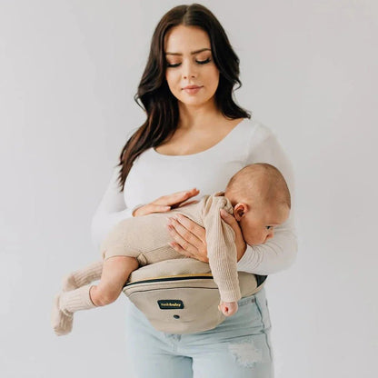 Tushbaby Hip Carrier for babies and toddlers, featuring ergonomic design and adjustable straps for comfortable carrying.