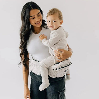Tushbaby Hip Carrier for babies and toddlers, ergonomic design with padded straps and supportive waistband for comfortable carrying
