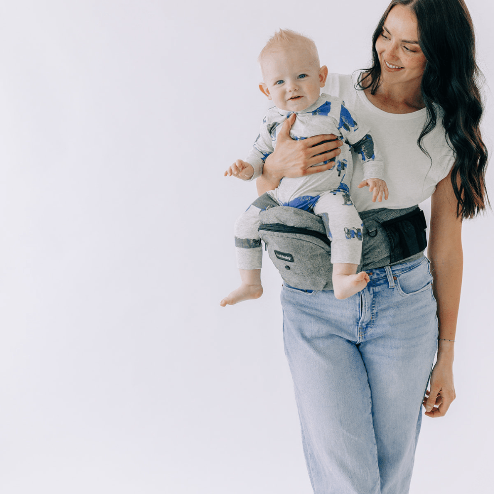 Tushbaby Hip Carrier for babies and toddlers, showing a comfortable, ergonomic design with padded straps and waist support.