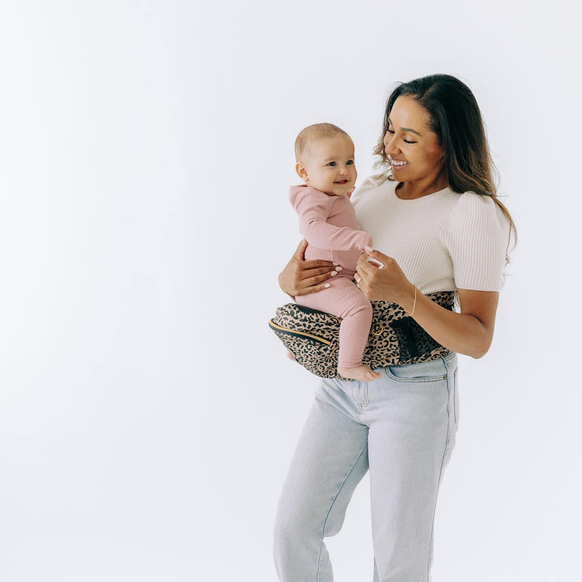 Baby and toddler hip carrier by Tushbaby, showing adjustable straps and ergonomic design for comfortable carrying.