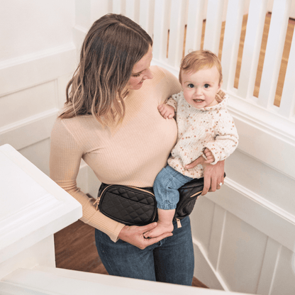 Tushbaby Hip Carrier for baby and toddler, showing adjustable straps and ergonomic design for comfortable carrying.