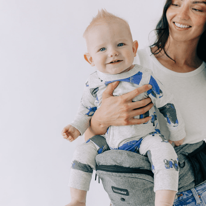 Tushbaby Hip Carrier for baby and toddler, featuring padded straps and supportive design for comfortable carrying.