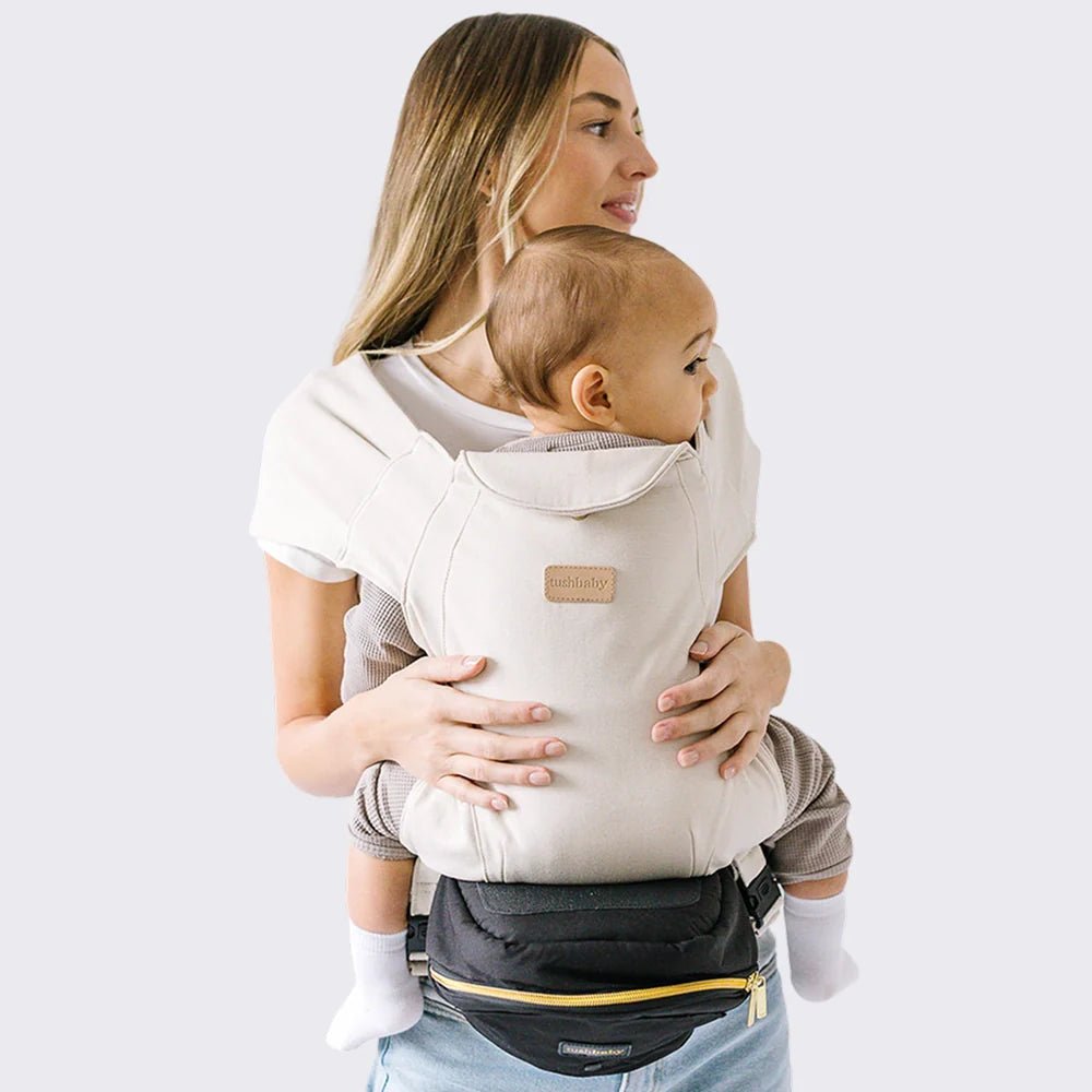 Tushbaby Hip Carrier for babies and toddlers, featuring adjustable straps and ergonomic design for comfortable carrying.