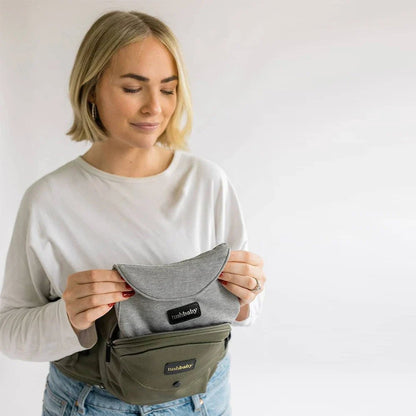 Tushbaby Hip Carrier for baby and toddler in soft fabric, designed for comfortable carrying and support.