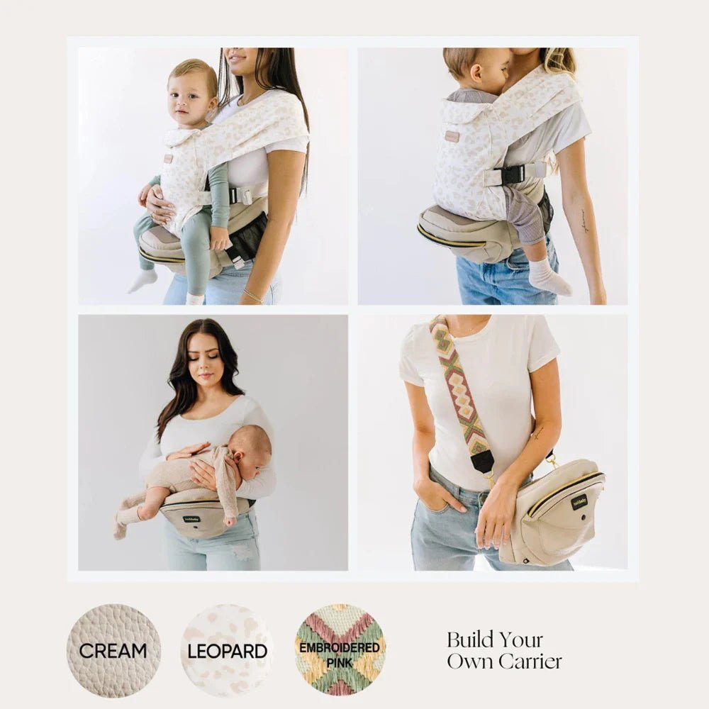 Tushbaby Hip Carrier for baby and toddler in black, with padded straps and ergonomic design for comfortable carrying.