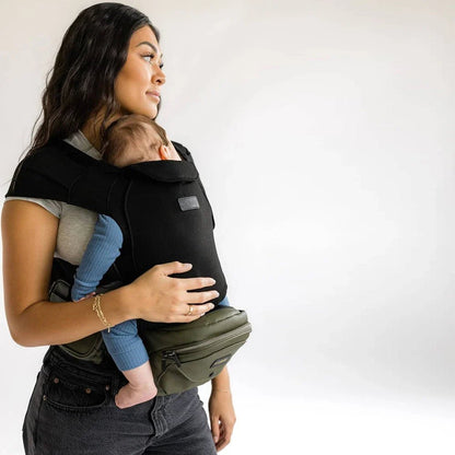 Baby and toddler hip carrier by Tushbaby, showcasing ergonomic design and adjustable straps for comfortable carrying.
