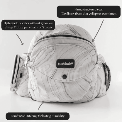 Tushbaby Hip Carrier for babies and toddlers, adjustable ergonomic design with padded straps and supportive waistband.