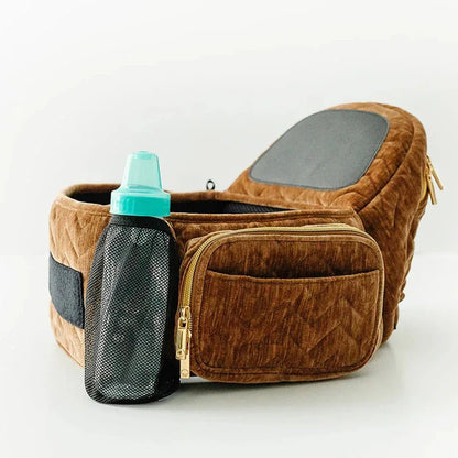Tushbaby Hip Carrier for babies and toddlers, featuring adjustable straps and ergonomic design for comfortable carrying.