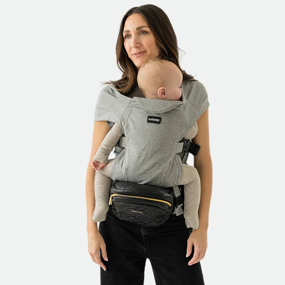 Tushbaby Hip Carrier for babies and toddlers, showing a comfortable, ergonomic design in soft fabric with adjustable straps.