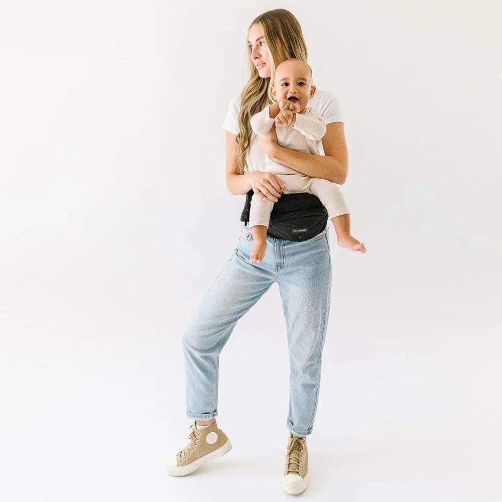Tushbaby Hip Carrier for baby and toddler, showing the ergonomic design and adjustable straps for comfortable carrying.