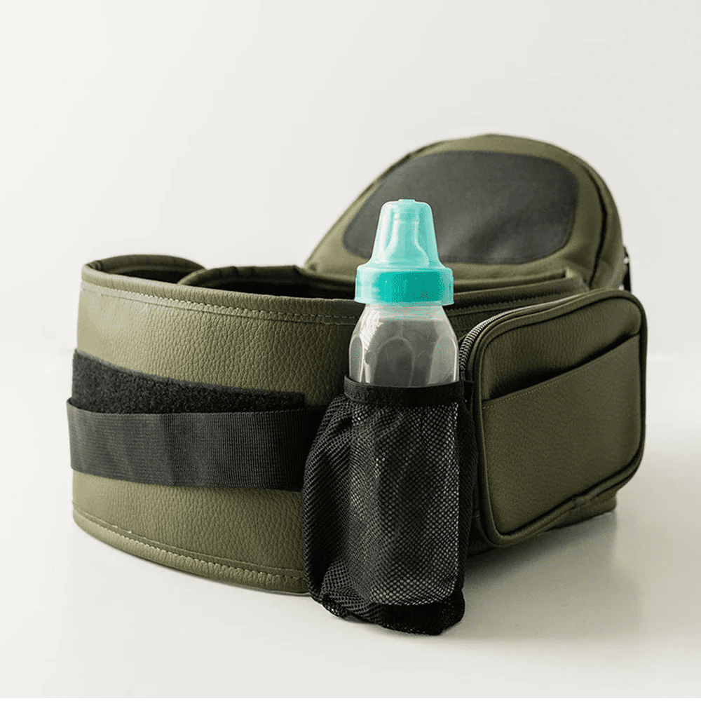 Tushbaby Hip Carrier for babies and toddlers in black, with adjustable straps and ergonomic design for comfortable carry.
