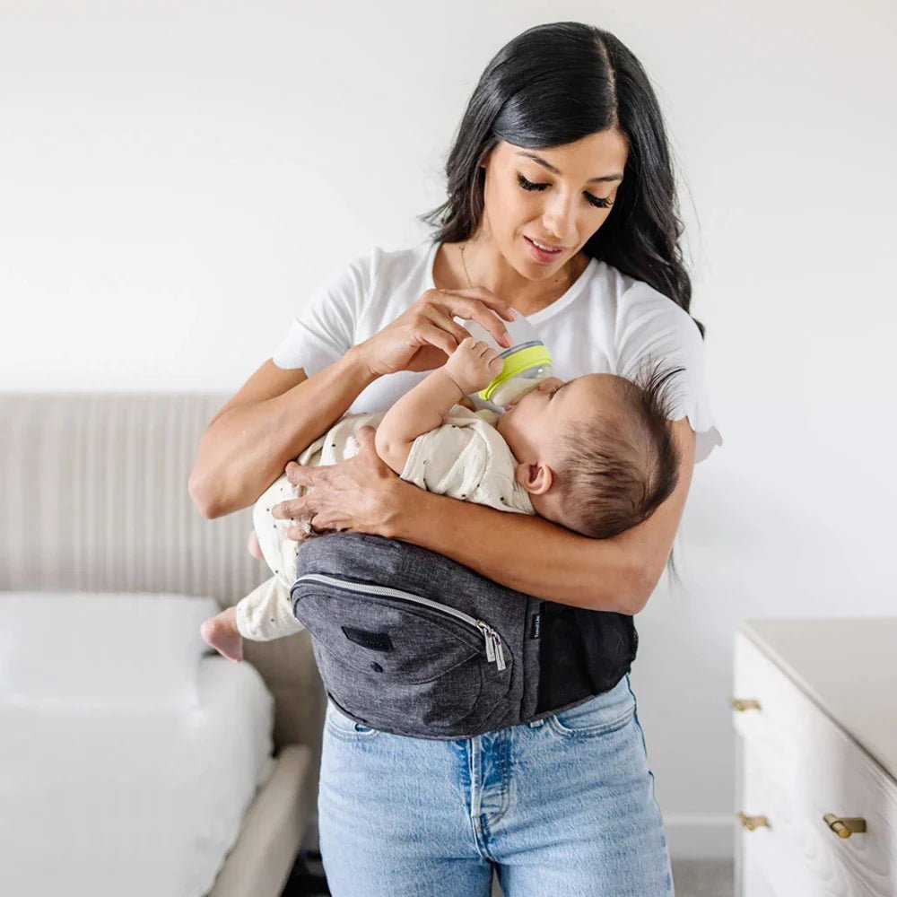 Tushbaby hip carrier for babies and toddlers, shown in a neutral color, designed to comfortably carry a young child on the hips.
