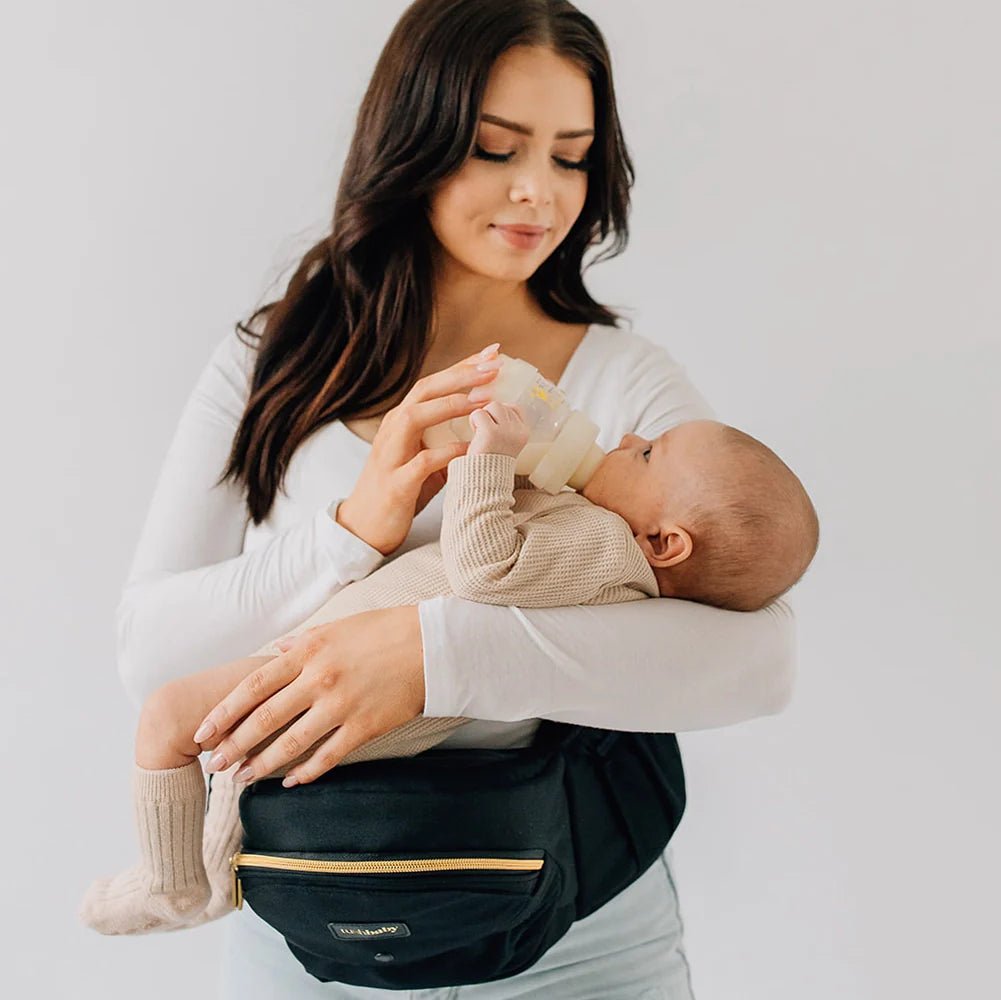 Tushbaby Hip Carrier for baby and toddler in soft fabric with adjustable straps, designed for comfortable carrying.