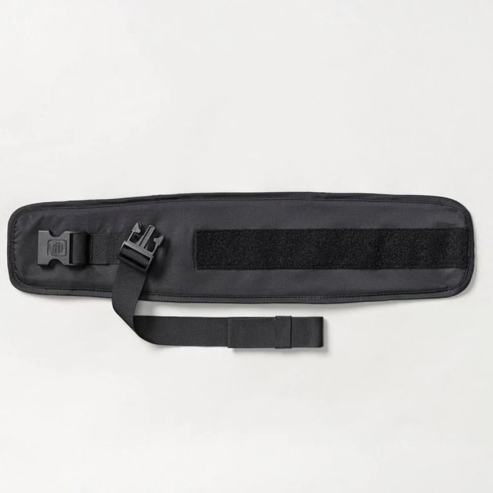 Tushbaby Waistband Extender for Baby and Toddler, adjustable strap for comfortable fit, shown attached to waistband.