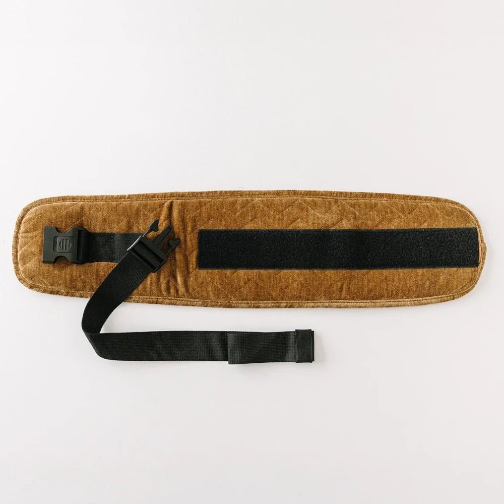 Tushbaby Waistband Extender for Baby & Toddler, showing adjustable fabric and secure hooks for comfortable fit.
