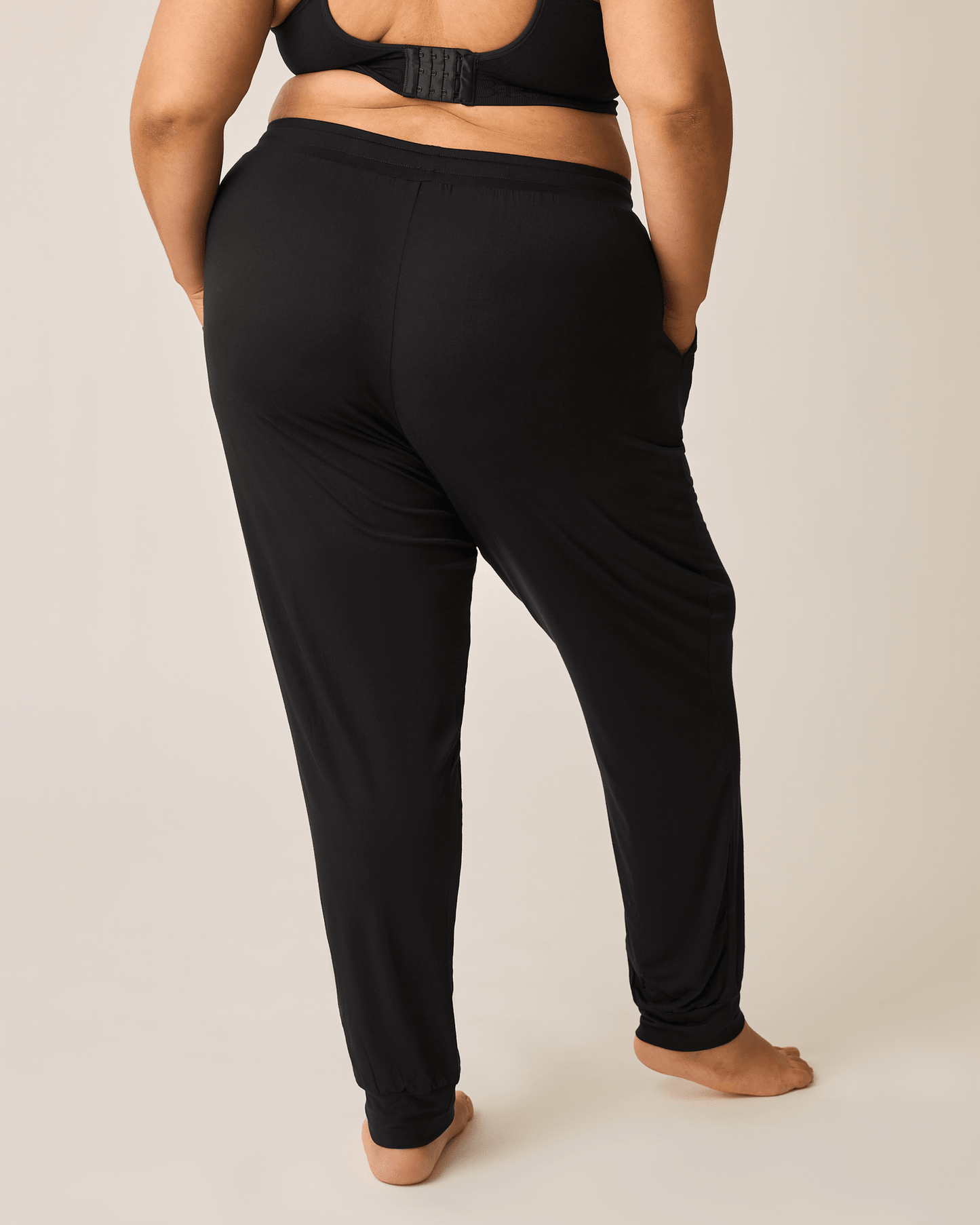 Black ultralight sleep and lounge jogger bottoms by Kindred Bravely, featuring a relaxed fit and soft fabric for comfort.