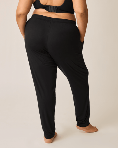 Black ultralight sleep and lounge jogger bottoms by Kindred Bravely, featuring a relaxed fit and soft fabric for comfort.
