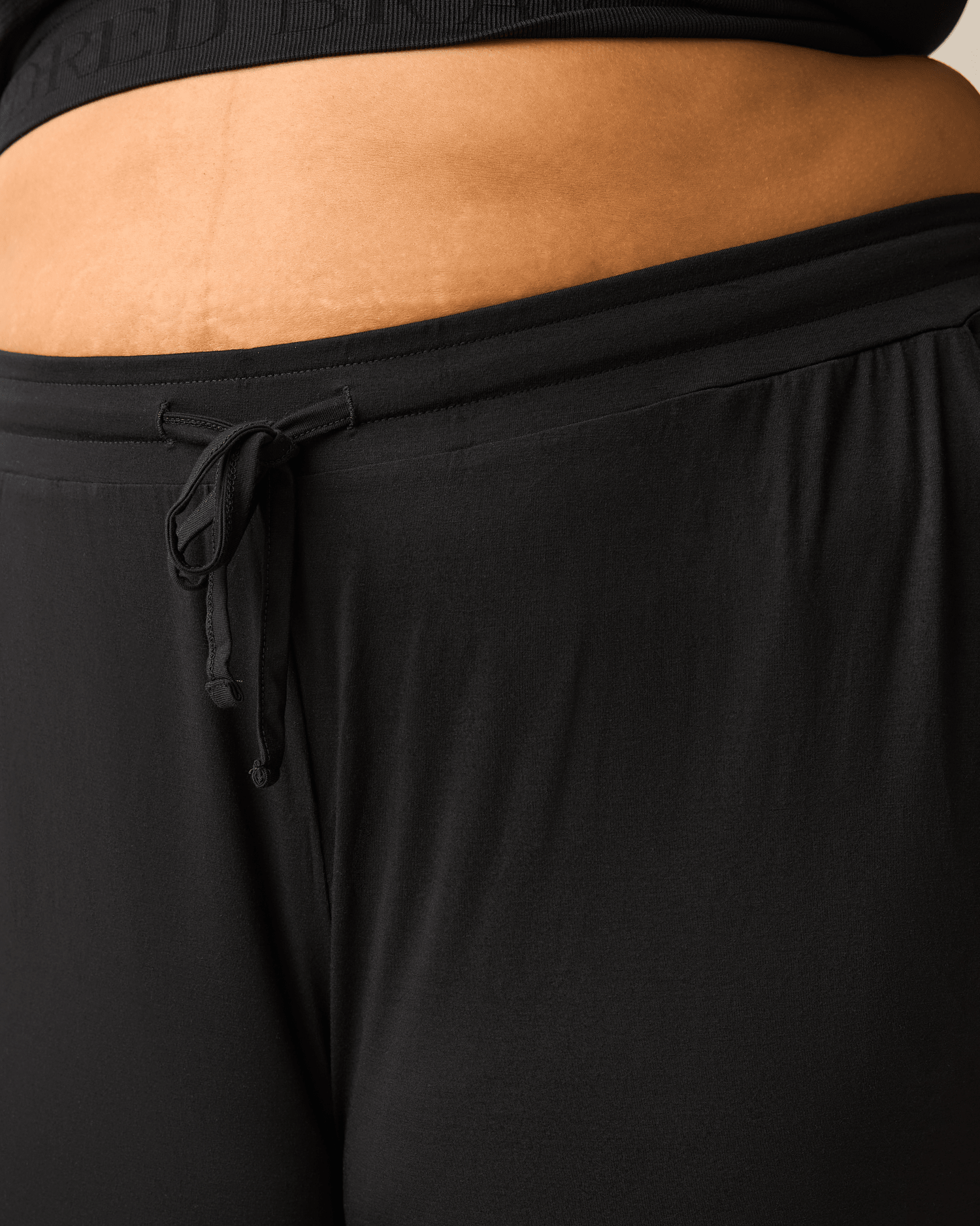 Black ultralight sleep and lounge joggers from Kindred Bravely, featuring a relaxed fit and comfortable elastic waistband.