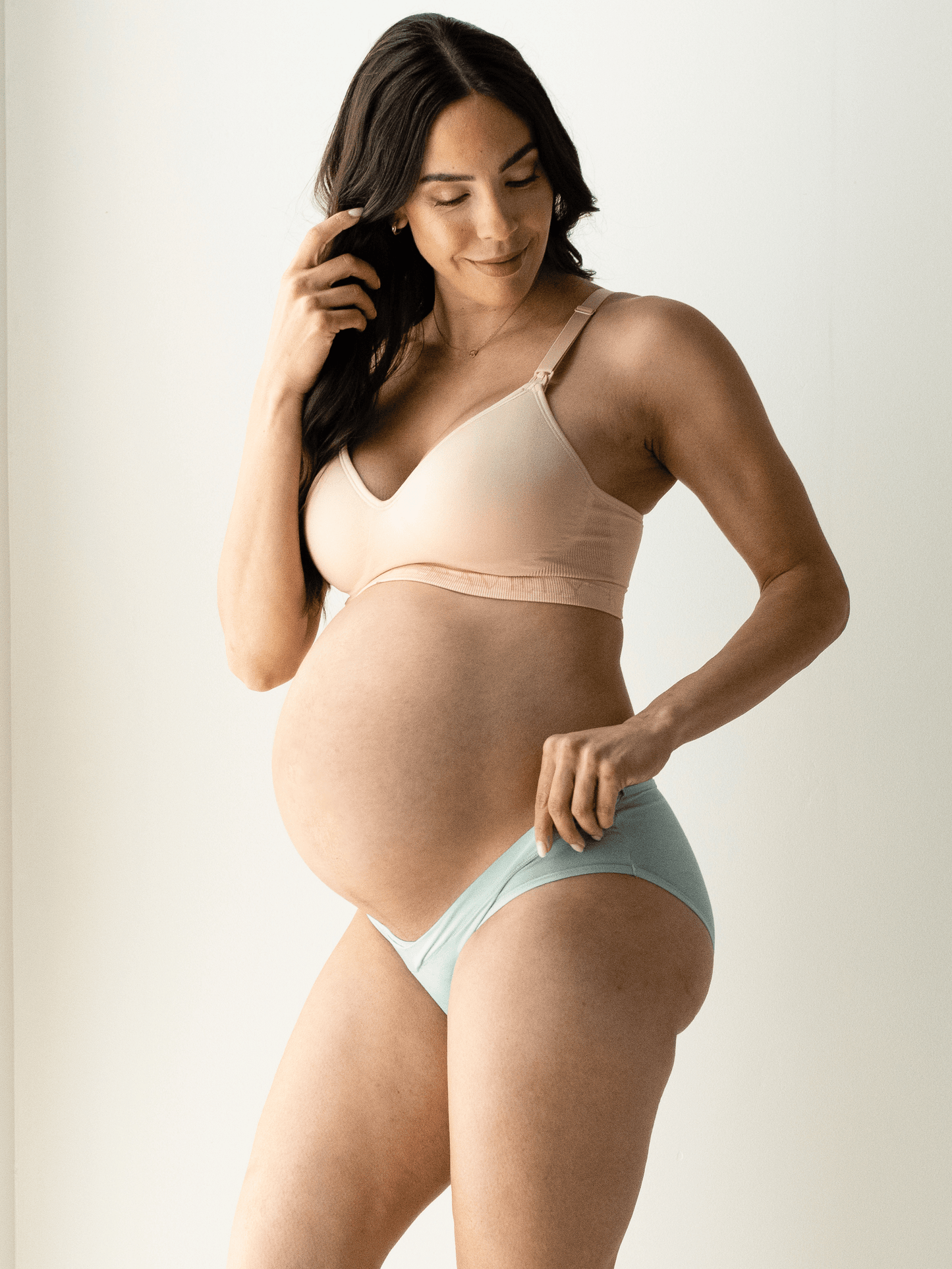 Assorted under-the-bump bikini underwear pack by Kindred Bravely, low-rise style with comfortable, stretchy fabric for maternity wear.