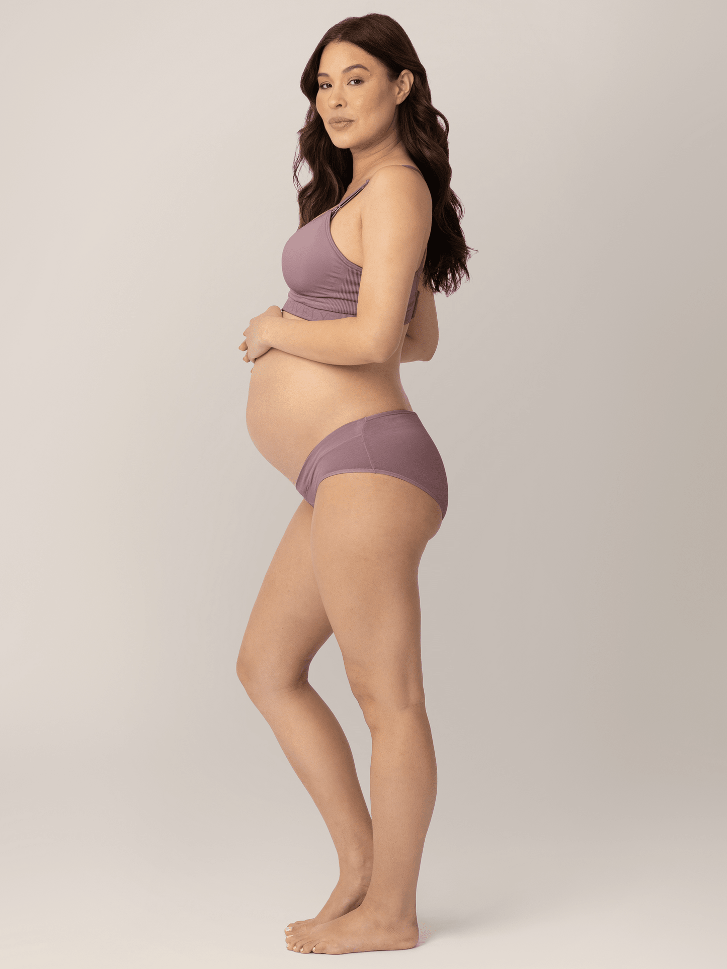 Assorted under-the-bump bikini underwear pack by Kindred Bravely, low-rise style with comfortable fit, displayed in a neat collection.