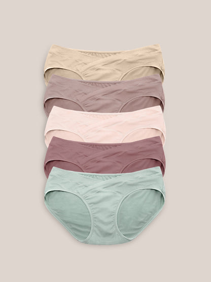 Assorted under-the-bump bikini underwear pack by Kindred Bravely, low-rise style with comfortable fit, shown in various colors.