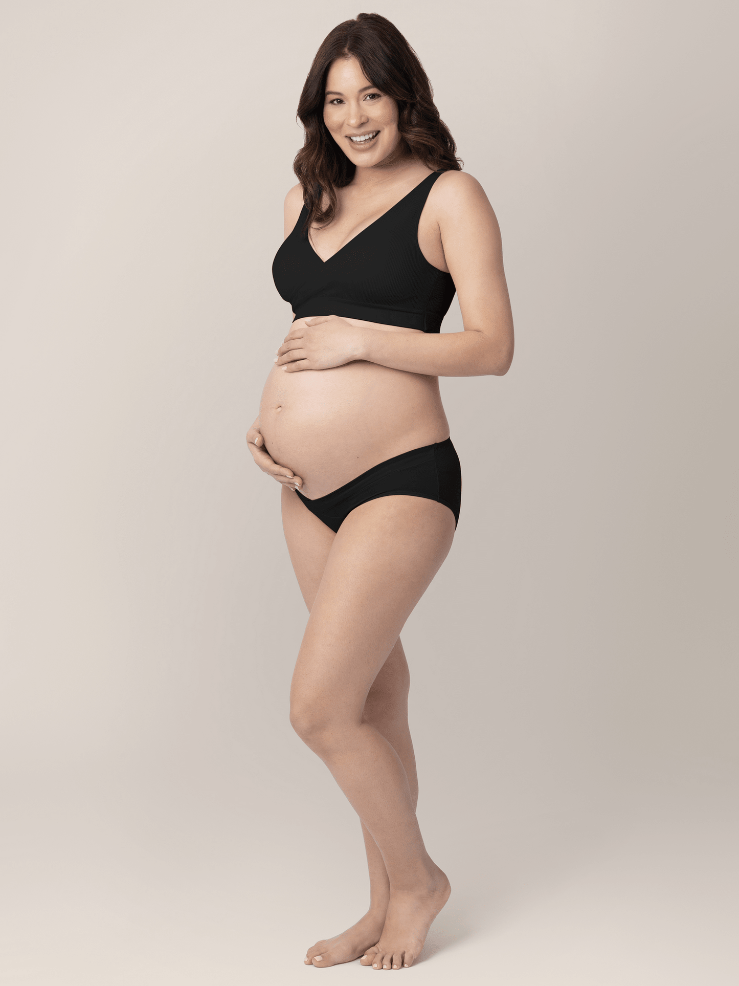 Set of neutral-colored under-the-bump bikini underwear from Kindred Bravely, featuring low-rise, comfortable maternity underwear.