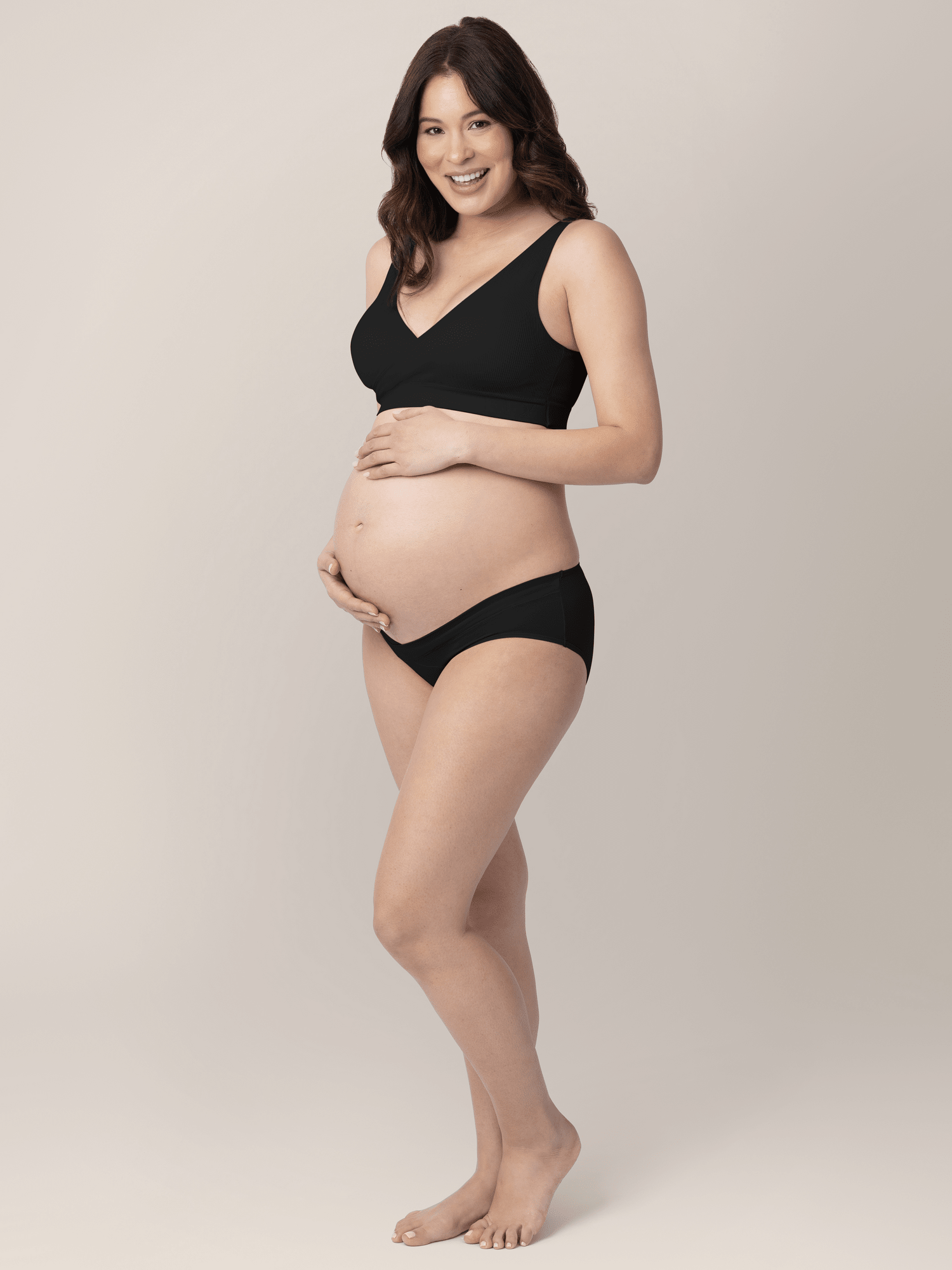 Set of neutral-colored under-the-bump bikini underwear from Kindred Bravely, featuring low-rise, comfortable maternity underwear.