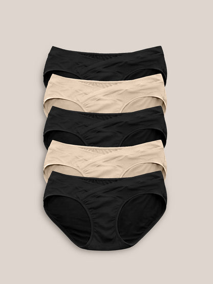 Set of neutral-colored under-the-bump bikini underwear by Kindred Bravely, low-rise style, soft and comfortable for maternity wear.